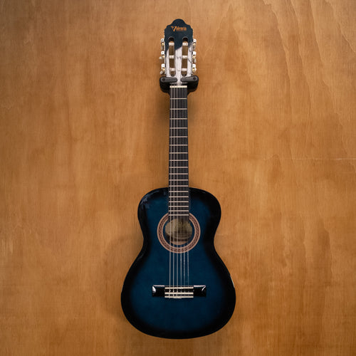 Valencia VC101 1/4 classical guitar in blue sunburst finish, showing the body, strings, and fretboard.