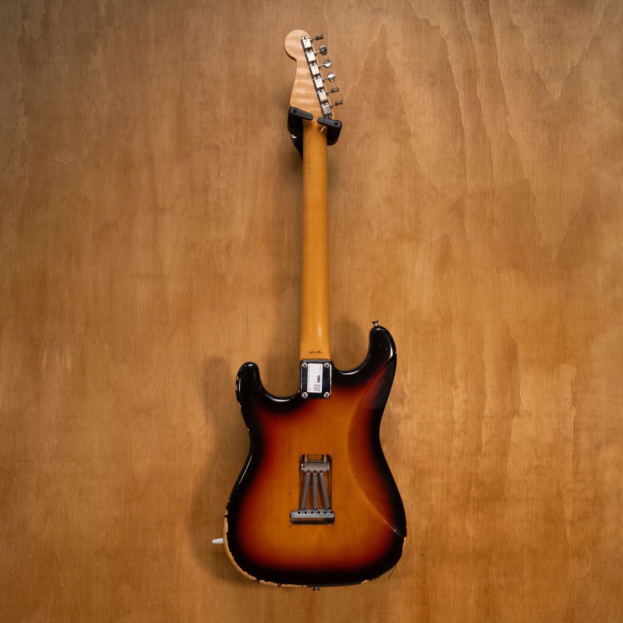 Fender '62 Reissue Stratocaster electric guitar made in Japan, with sunburst finish, maple neck, and vintage-style pickups.