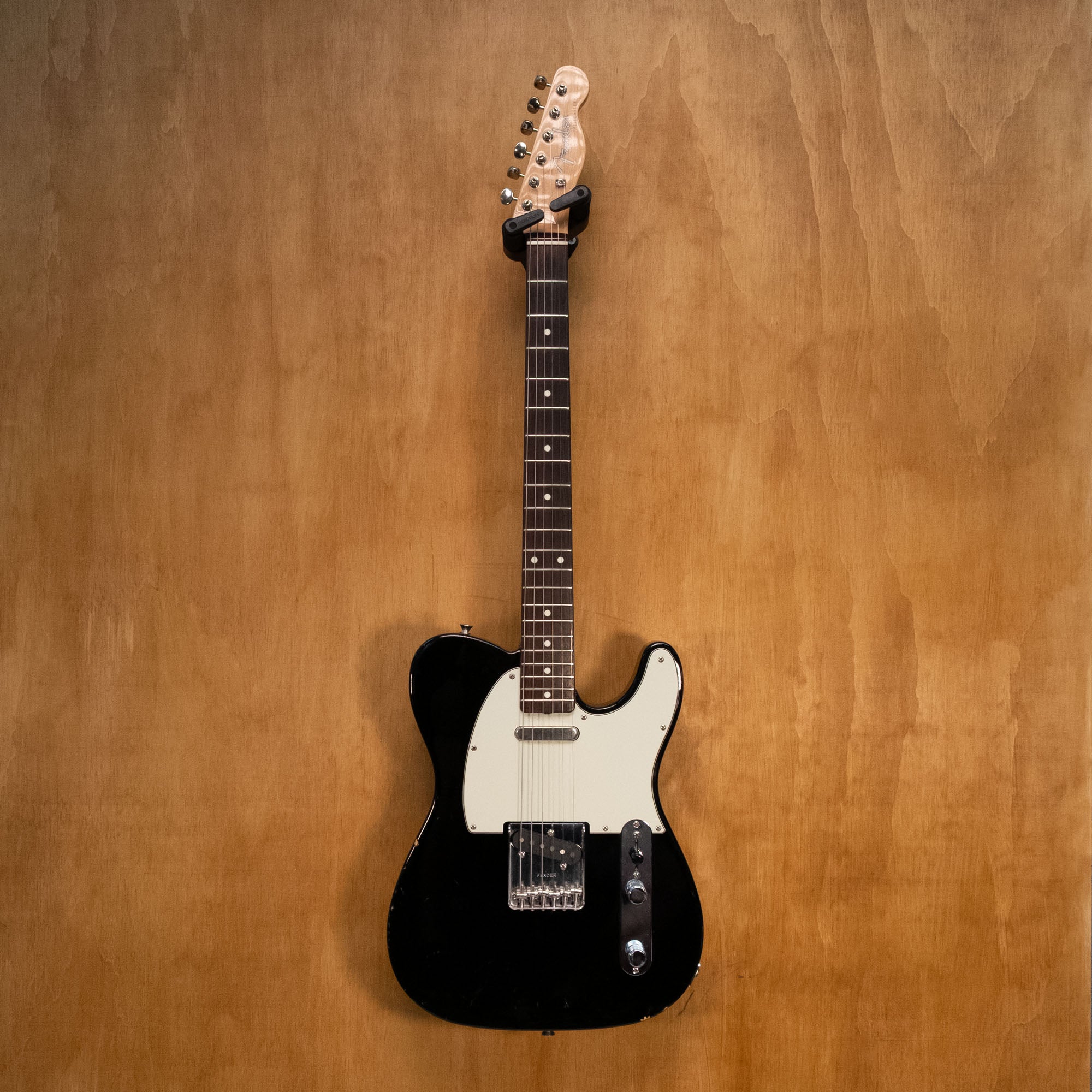 Fender Traditional '60s Telecaster electric guitar with black finish and rosewood fingerboard, made in Japan, preowned.