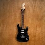 Fender '72 Reissue Stratocaster electric guitar in black with maple neck and three pickups, made in Japan.