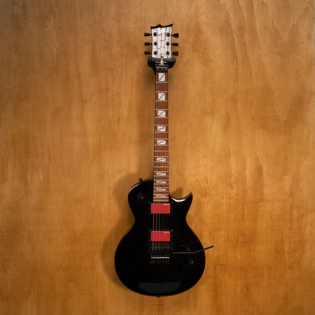 Preloved ESP LTD Gary Holt GH-200 signature electric guitar with black finish and sleek body, shown from front angle.