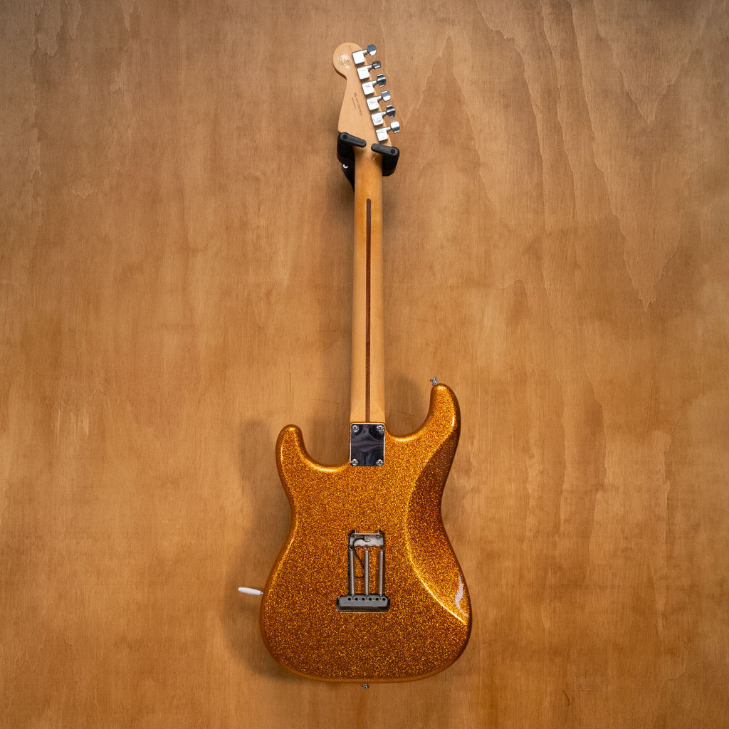Fender HSS Stratocaster Partscaster electric guitar in gold sparkle finish with maple neck and chrome hardware.
