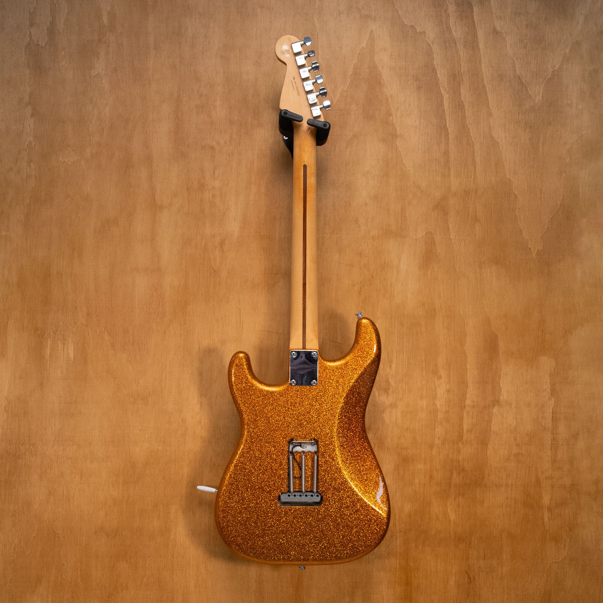 Fender HSS Stratocaster Partscaster electric guitar in gold sparkle finish with maple neck and chrome hardware.