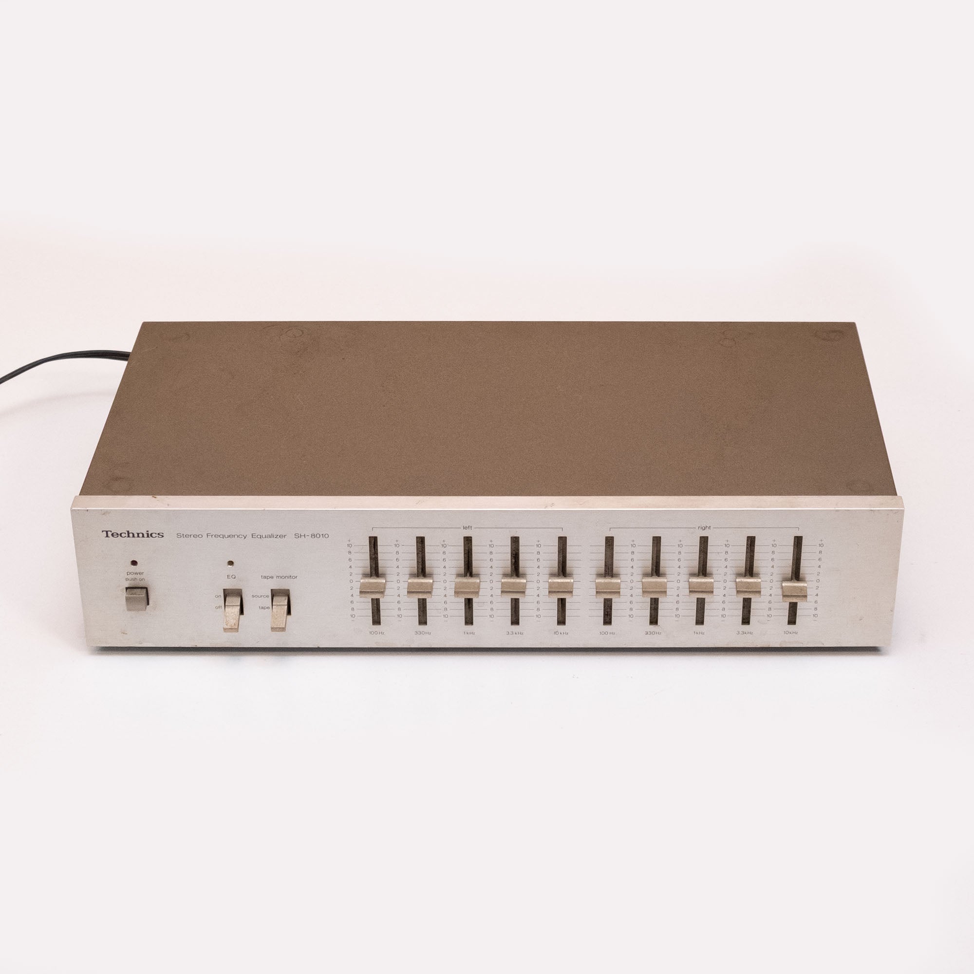 Technics SH-8010 stereo graphic equalizer for live outboard use, featuring multiple frequency sliders and vintage audio controls.