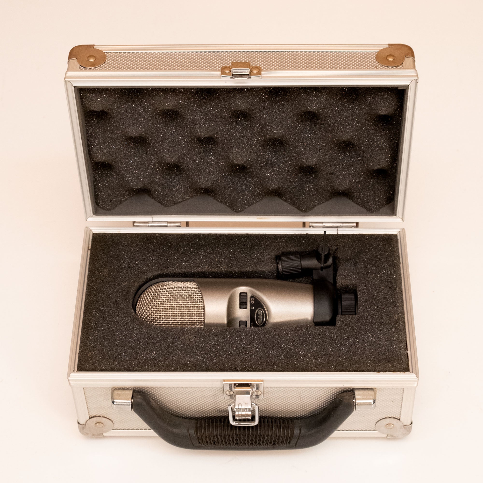 CAD M177 condenser studio microphone in hardcase, preowned, with professional-grade design for high-quality audio recording.