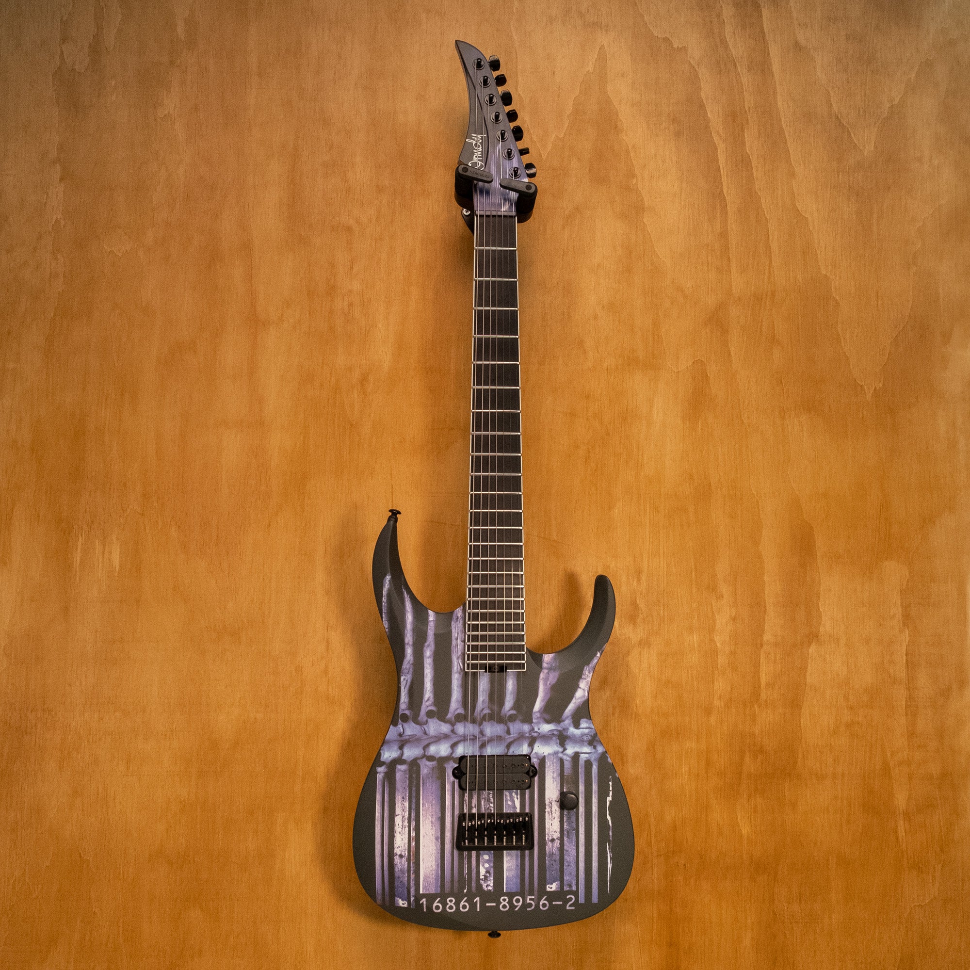 Ormsby Artist Series Dino Cazares DC GTR Demanufacture 7-string electric guitar with sleek design and detailed body artwork.