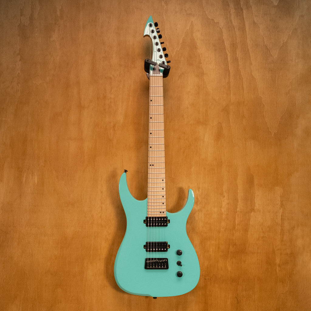 Ormsby Hype Run 18 standard scale 7-string electric guitar in seafoam green, showing the body and fretboard details.