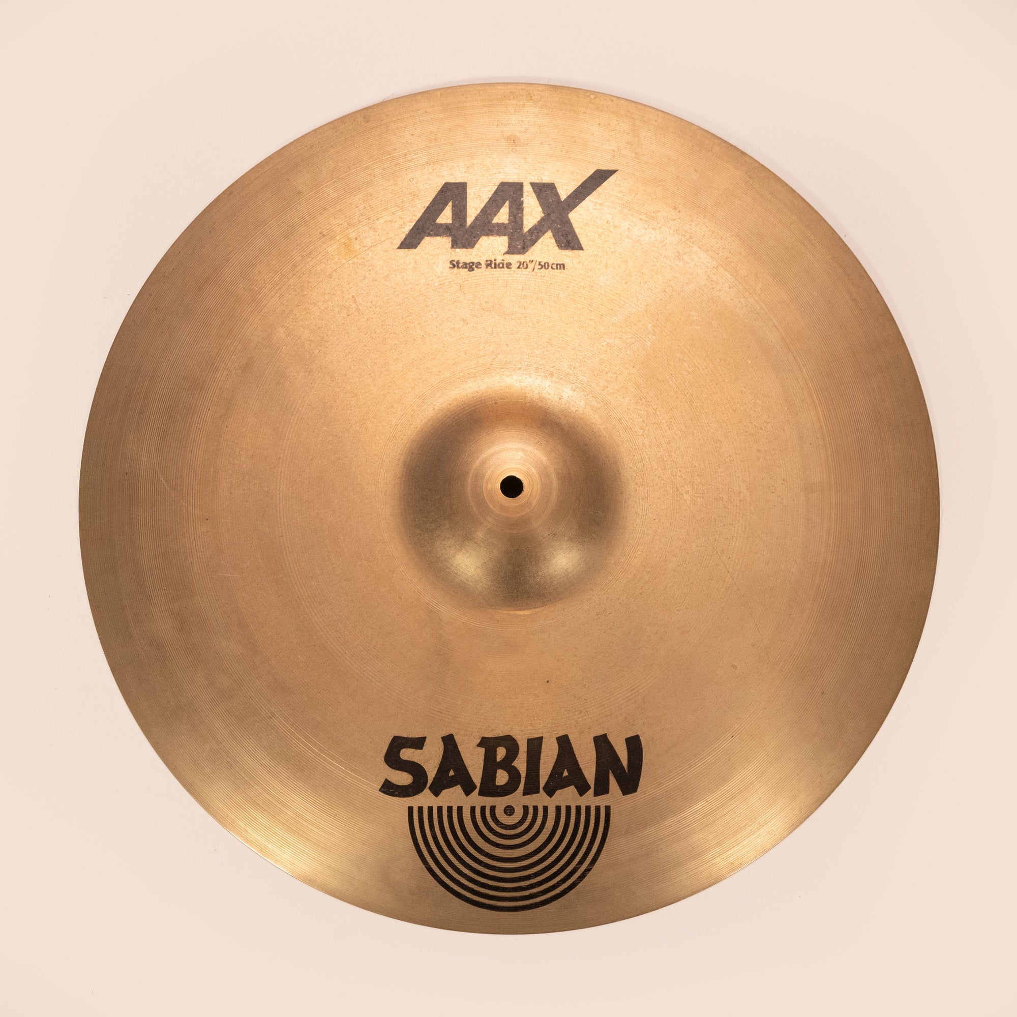 Preloved Sabian AAX 20-inch stage ride cymbal, single cymbal with a shiny metallic finish and detailed grooves visible.