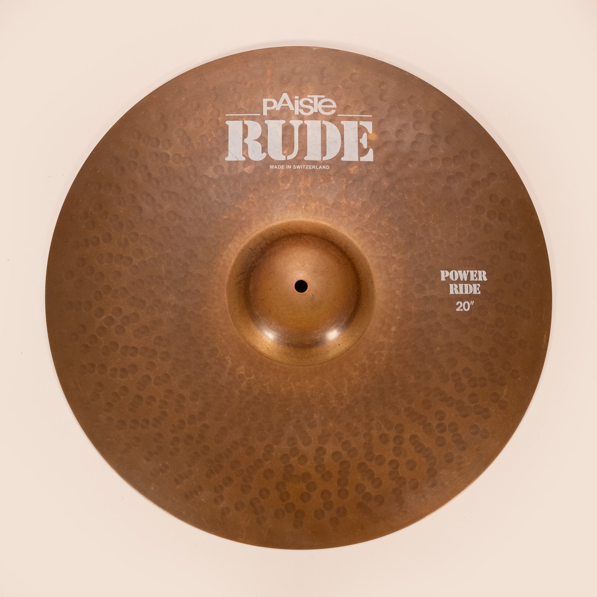 Preloved Paiste 20-inch Power Ride cymbal, single cymbal with a shiny bronze finish and detailed hammering visible.
