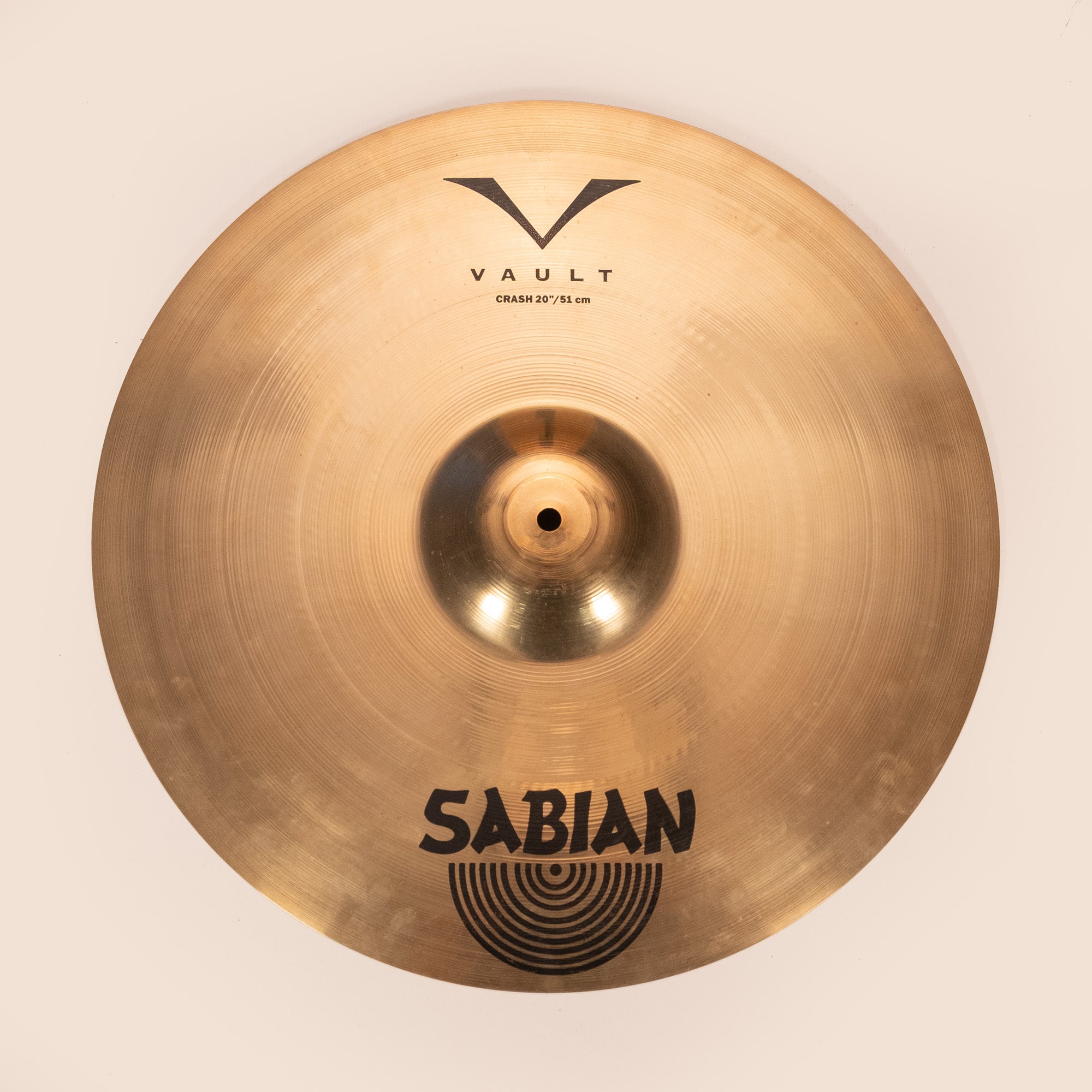 Sabian Vault 20-inch crash cymbal with brilliant finish, showcasing its size and detailed surface texture.