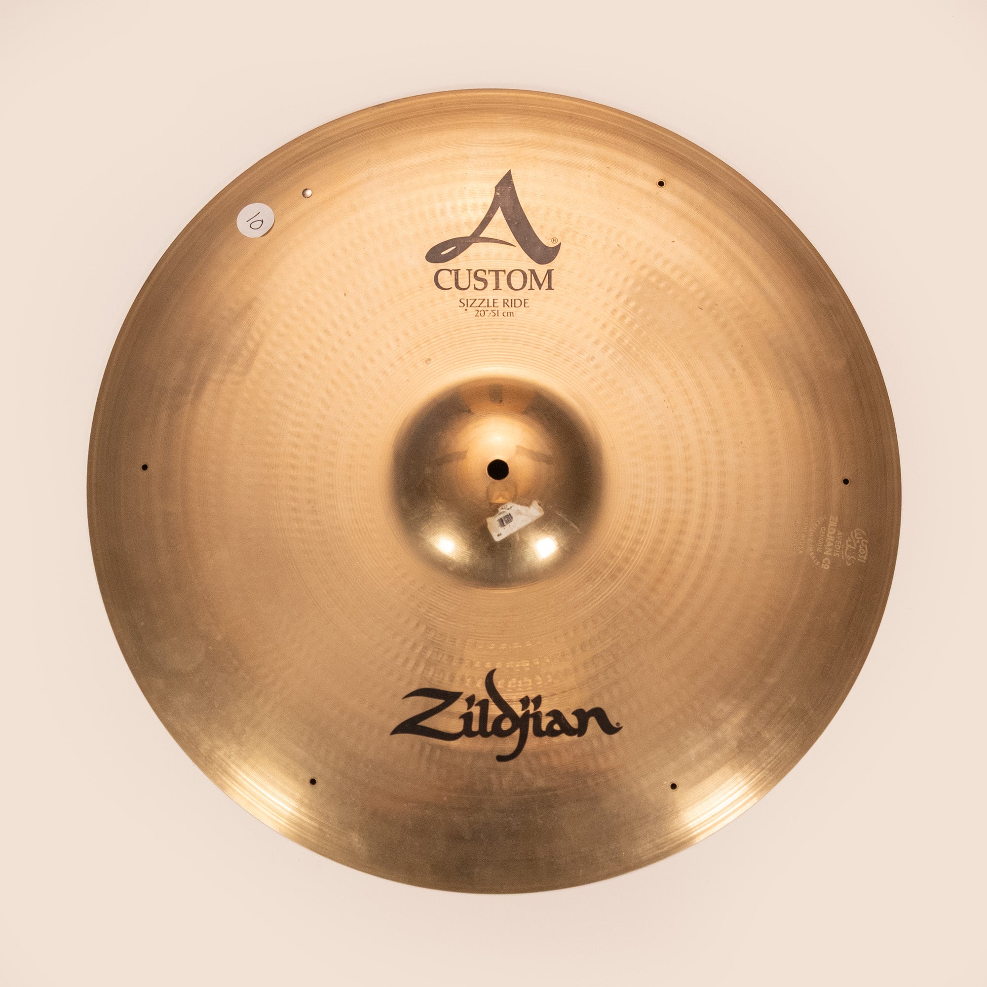 Preloved Zildjian A Custom 20-inch Sizzle Ride cymbal with a shiny finish, showing its detailed surface and branding.
