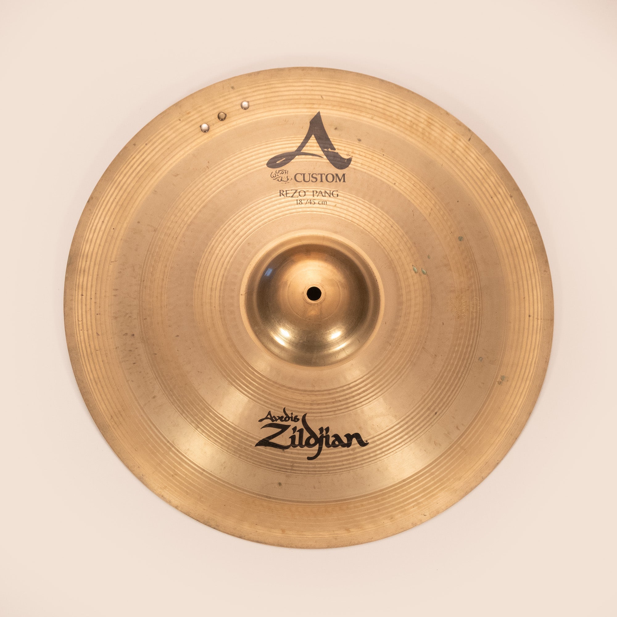 Zildjian A Custom 18-inch Rezo Pang cymbal with 3 rivets, showing a shiny bronze finish and detailed surface texture.