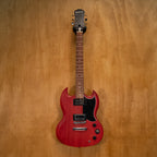 Epiphone SG electric guitar in worn cherry finish with black hardware and double-cutaway body, shown on a plain background.