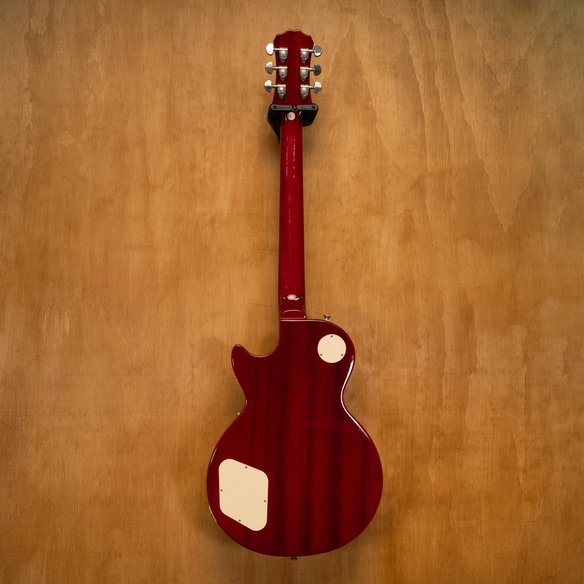 Epiphone Les Paul Standard Plus Top Pro electric guitar in Heritage Cherry Sunburst finish, showing the guitar's body and details.