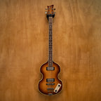 Greco VB-500 Violin Bass Guitar made in Japan, vintage 1983, with a natural wood finish and four strings, close-up view.