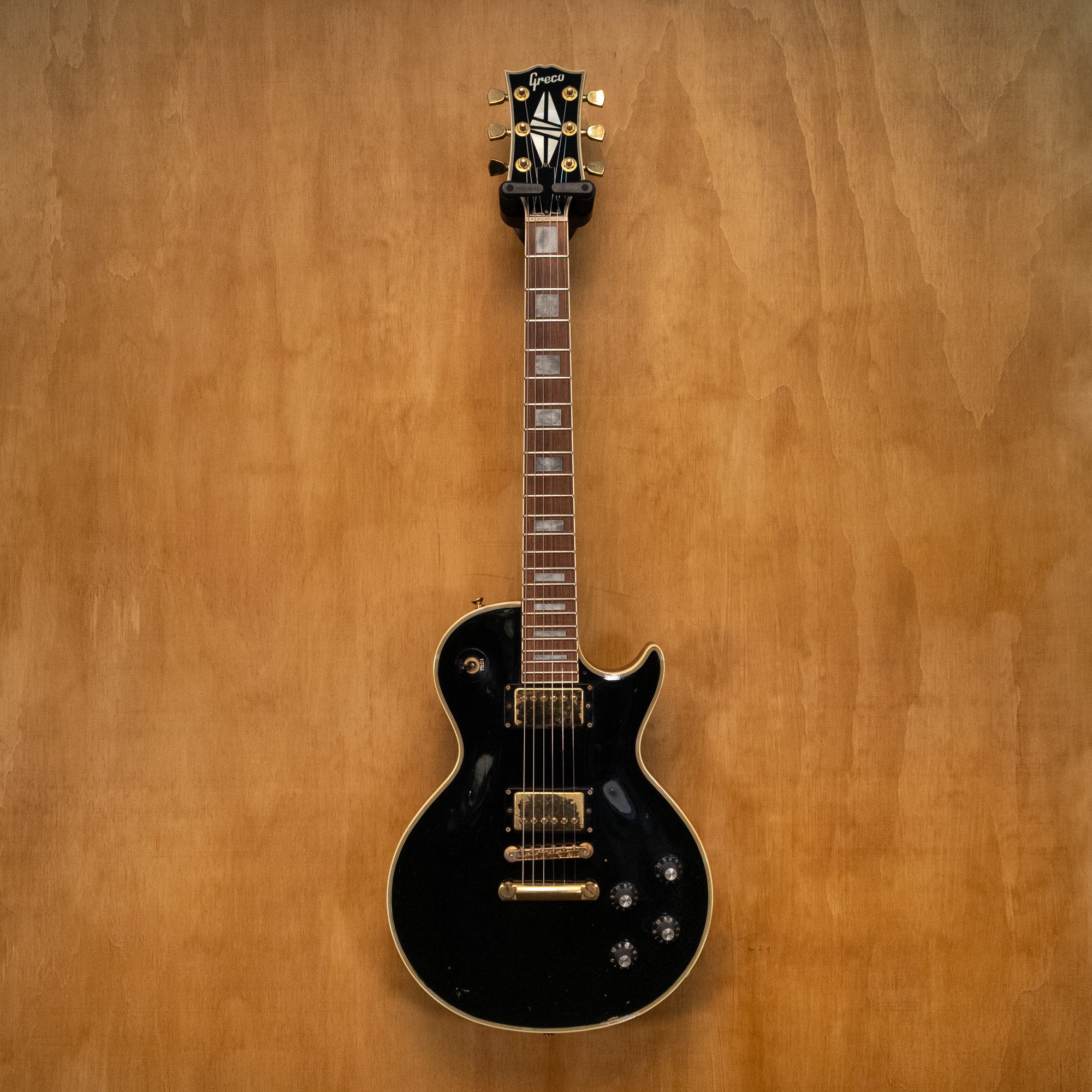 Greco LP Custom EGC-480 electric guitar in black, made in Japan 1989, featuring a solid body and classic design.