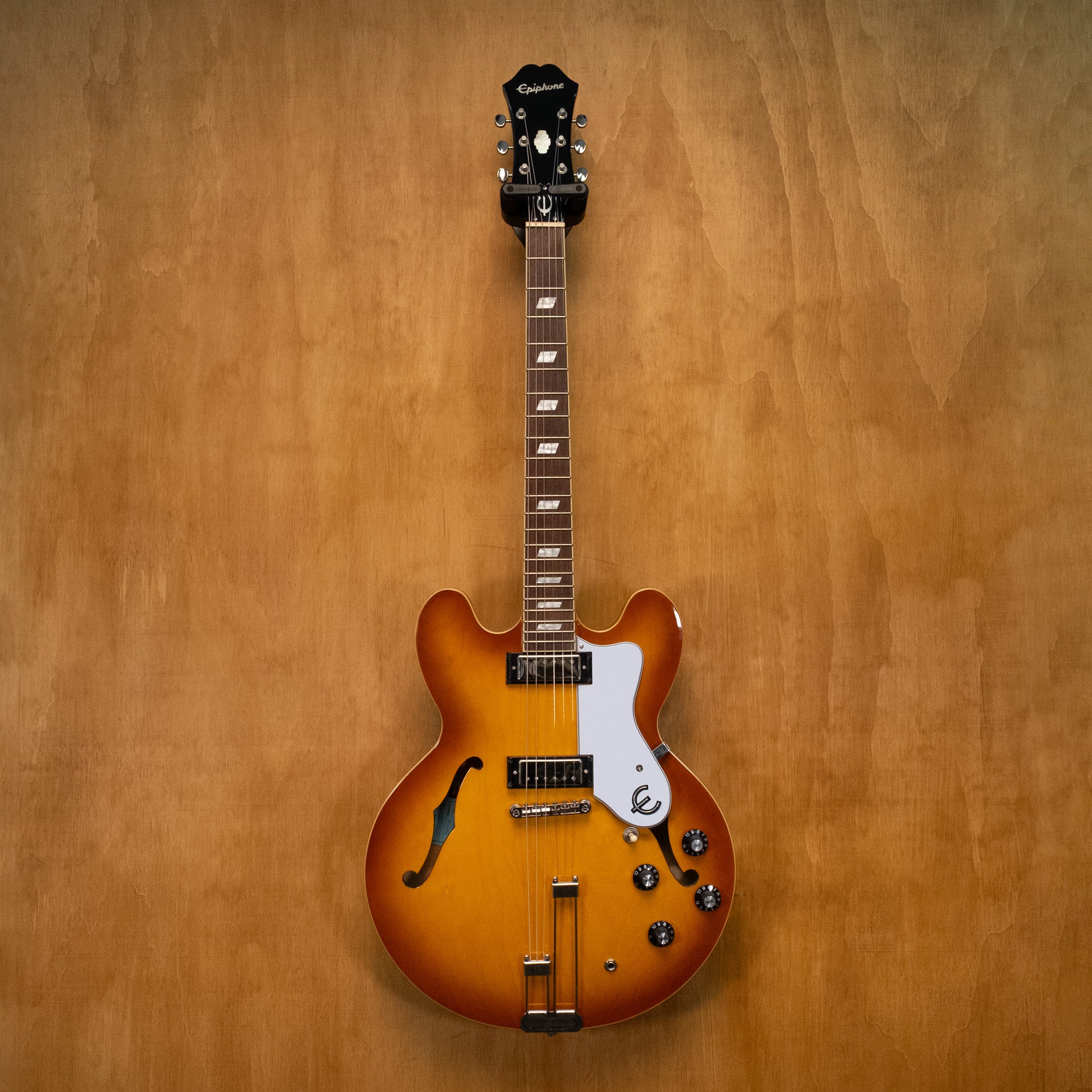 Epiphone Riviera E-360TD electric guitar in royal tan finish, showcasing its body, neck, and hardware details.