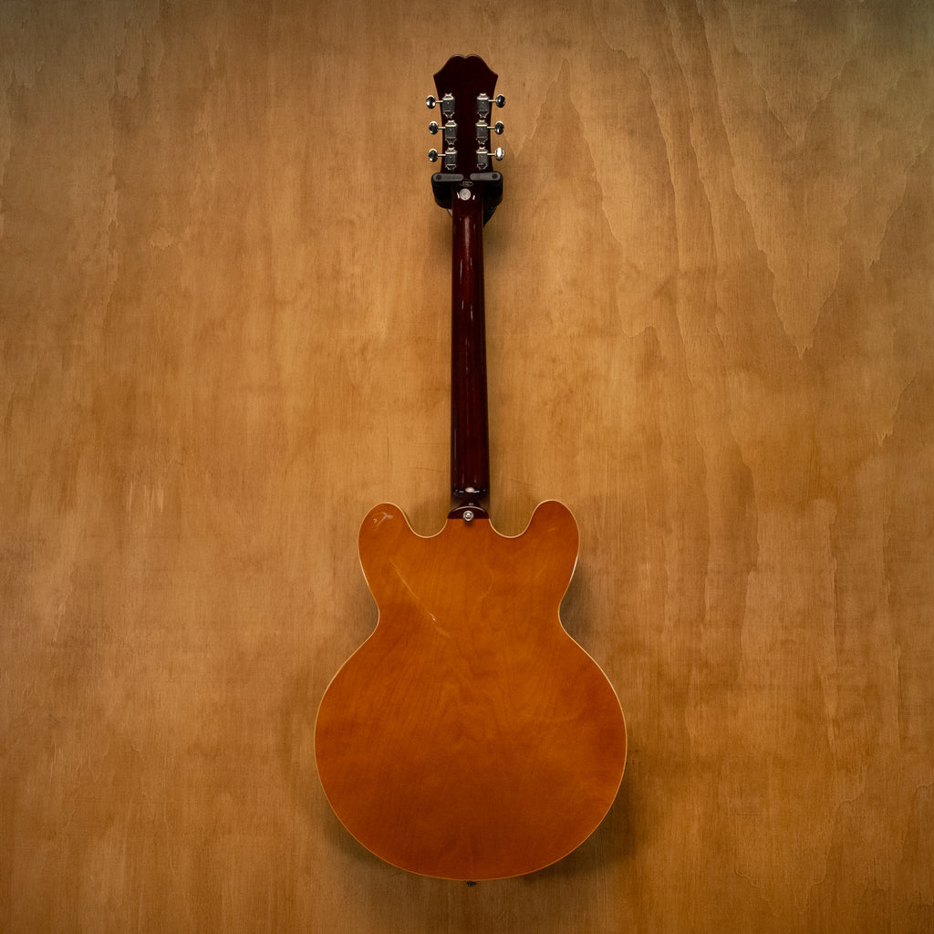 Epiphone Riviera E-360TD electric guitar in royal tan finish, showing the body, pickguard, and neck detail.