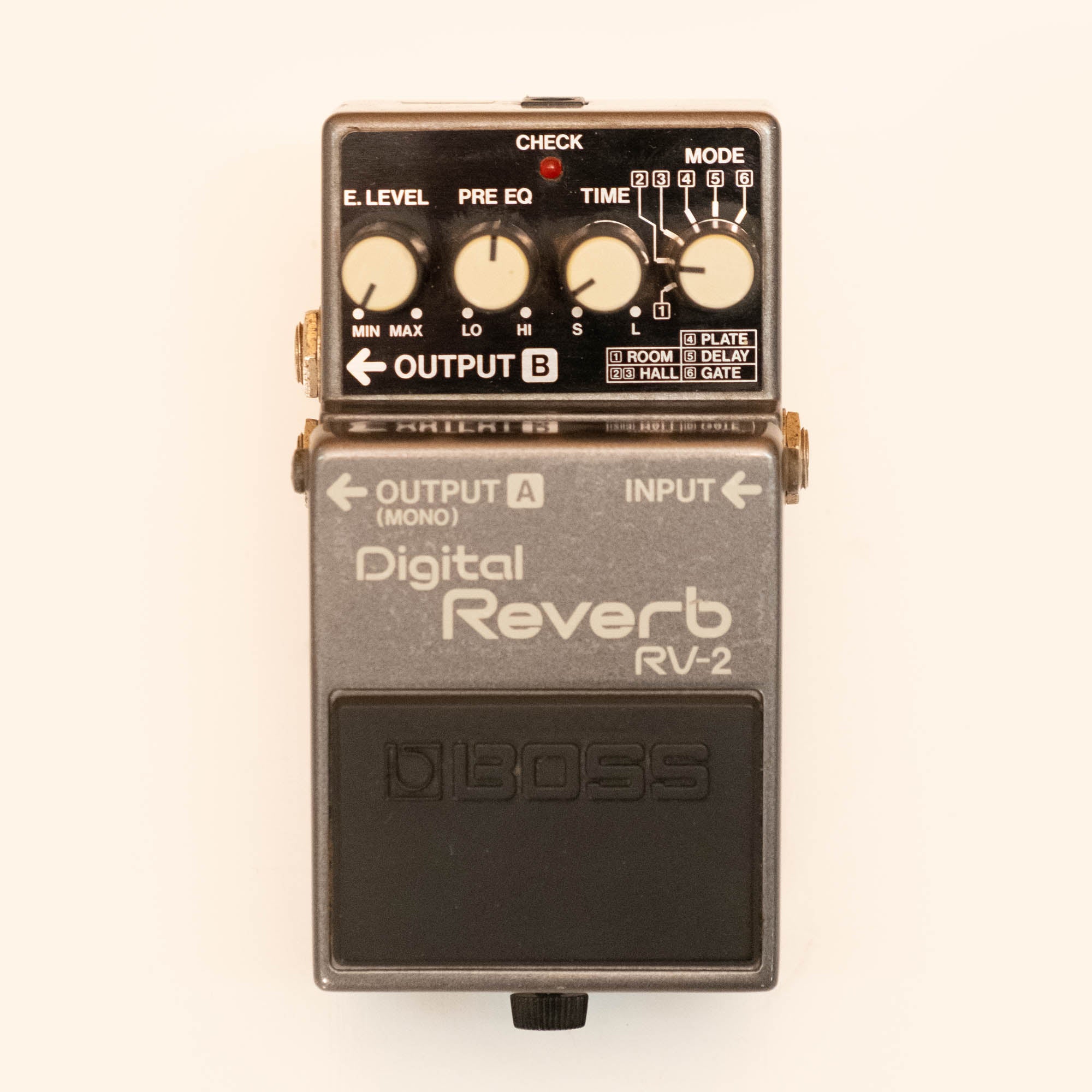 BOSS RV-2 digital reverb guitar effects pedal, single effects pedal with knob controls, used condition, shown on a white background.