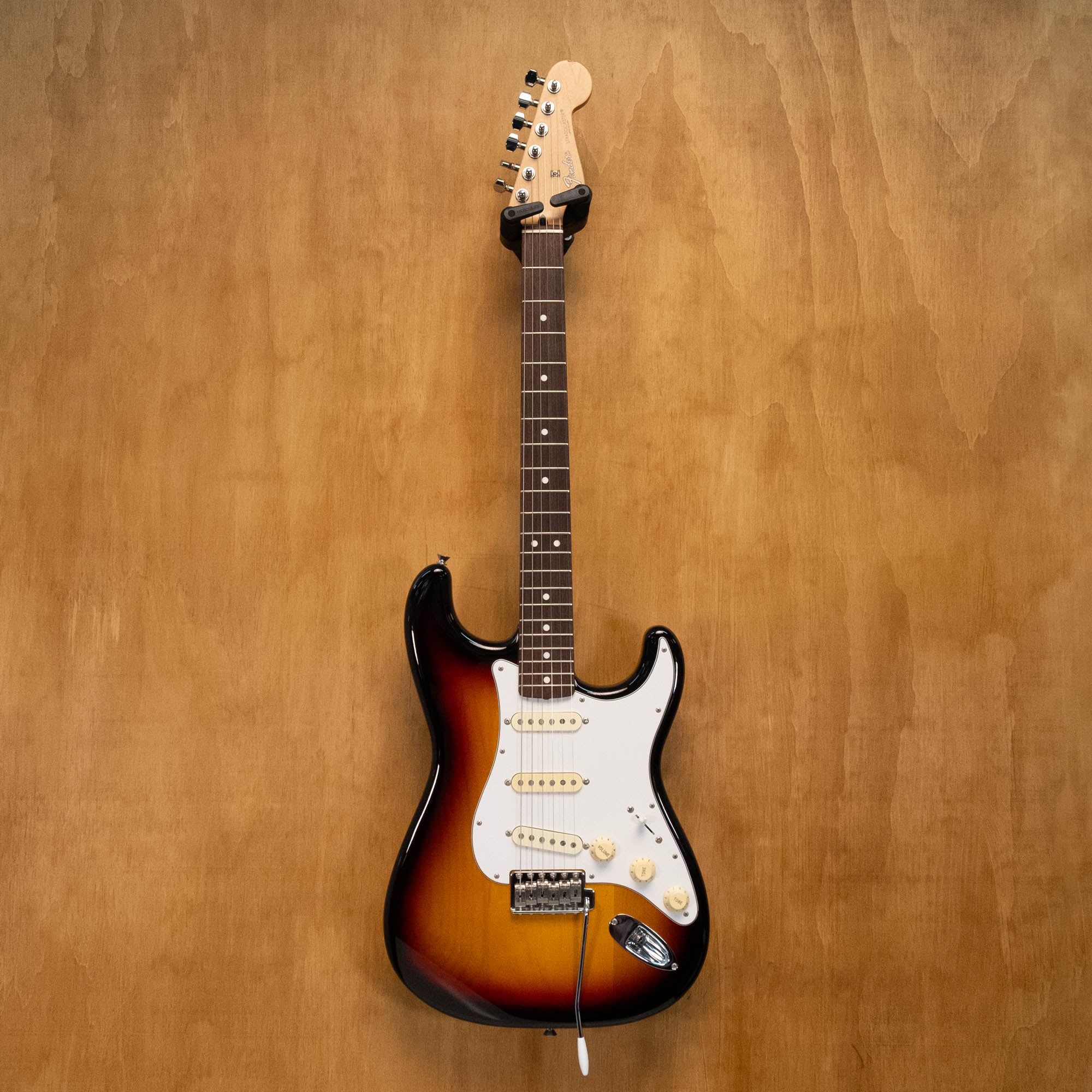 Fender Stratocaster ST-50 electric guitar in 3-tone sunburst finish with maple neck and chrome hardware, made in Japan.