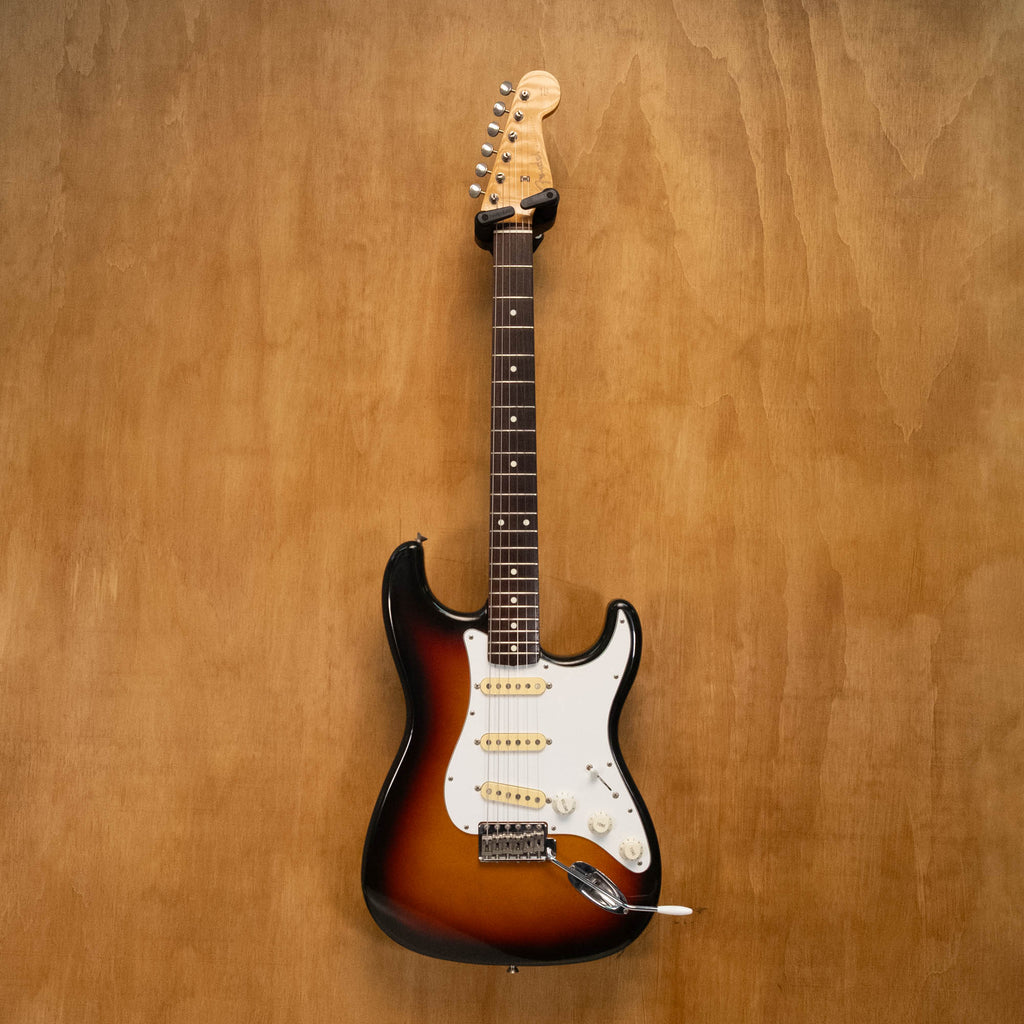 Fender '62 Stratocaster electric guitar in 3-tone sunburst finish, made in Japan, with maple neck and vintage-style pickups.