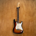 Fender '62 Stratocaster electric guitar in 3-tone sunburst finish, made in Japan, with maple neck and vintage-style pickups.
