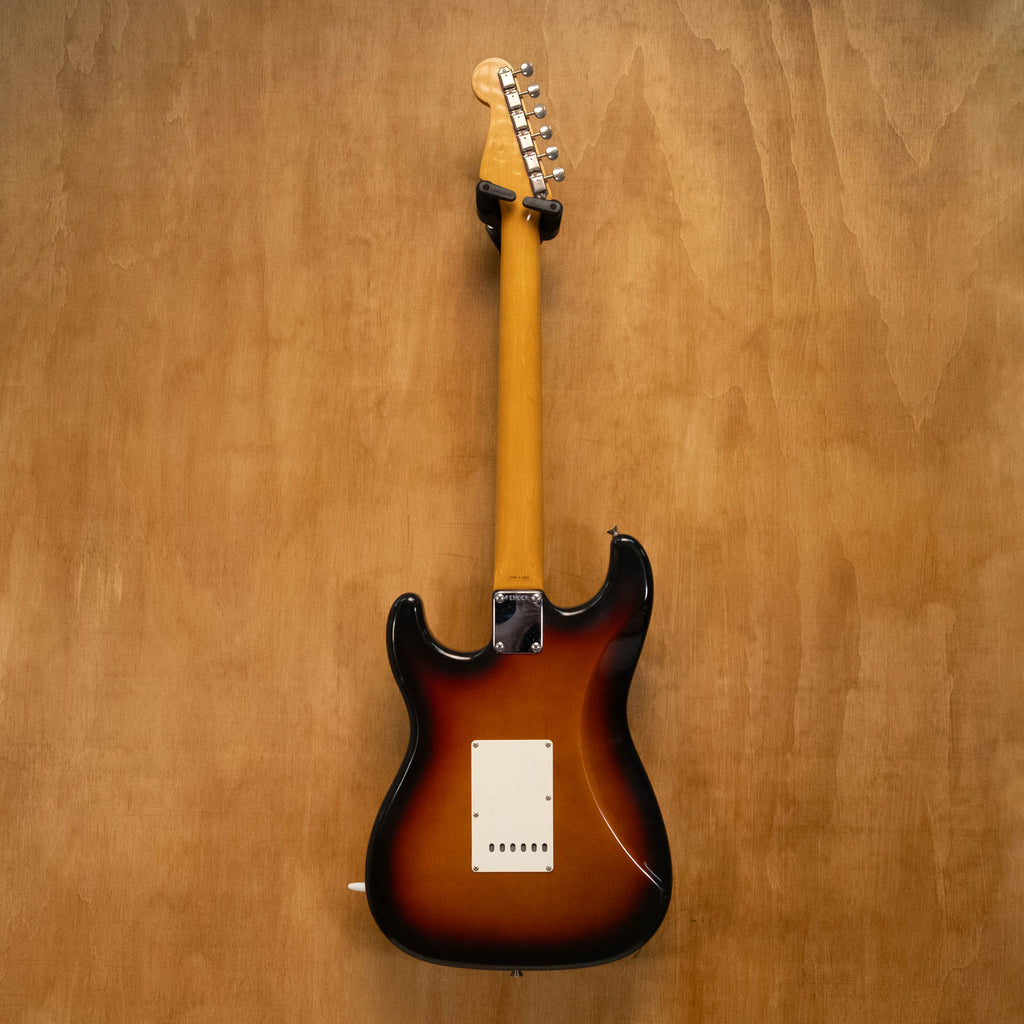 Fender '62 Stratocaster electric guitar in 3-tone Sunburst finish with maple neck and three pickups, made in Japan in the 1990s.
