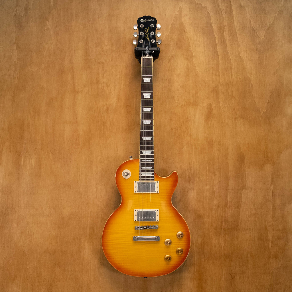 Epiphone Les Paul Standard Plus Top Pro electric guitar in honey burst finish, showing the body, pickups, and neck detail.