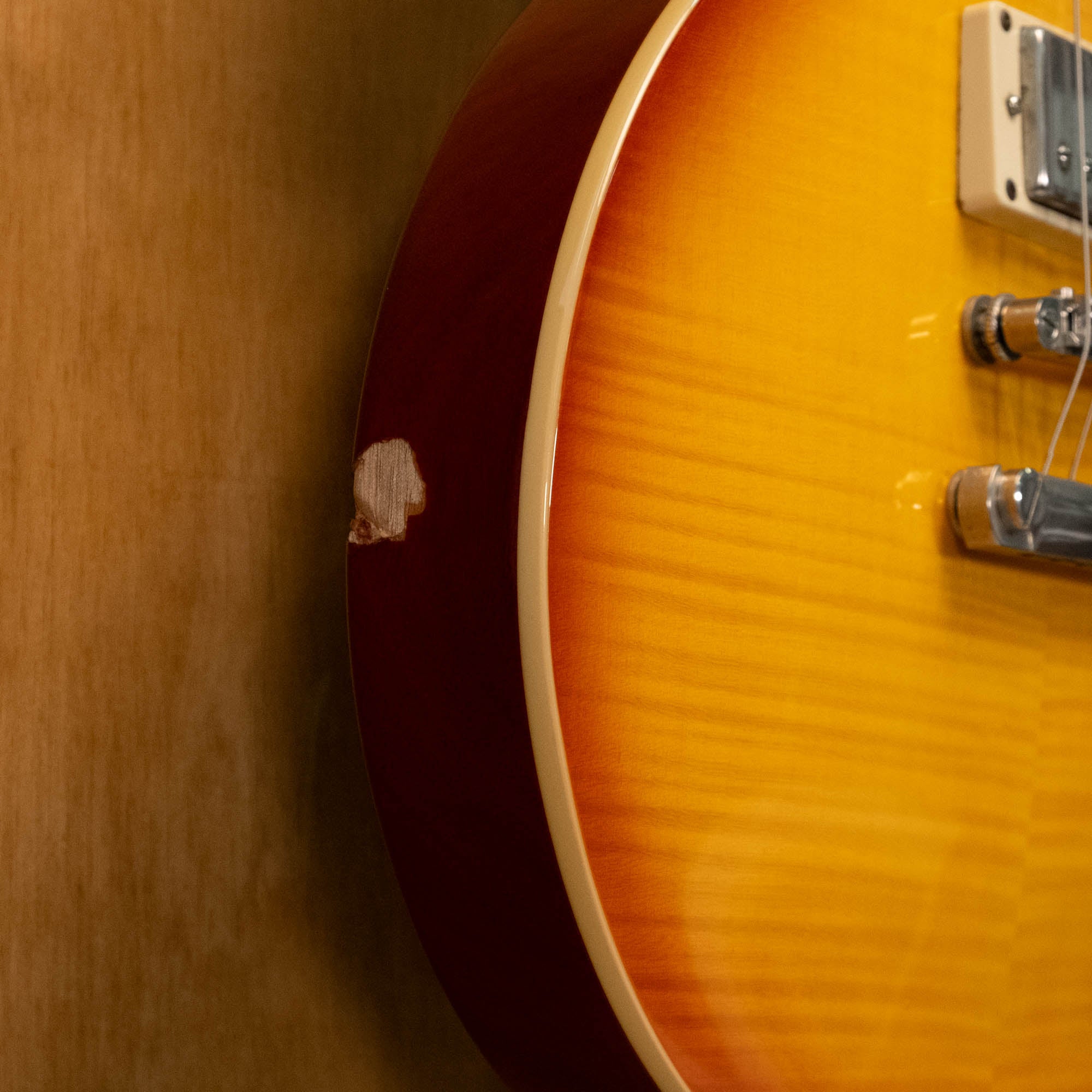 Epiphone Les Paul Standard Plus Top Pro electric guitar in honey burst finish, showing the body and chrome hardware.
