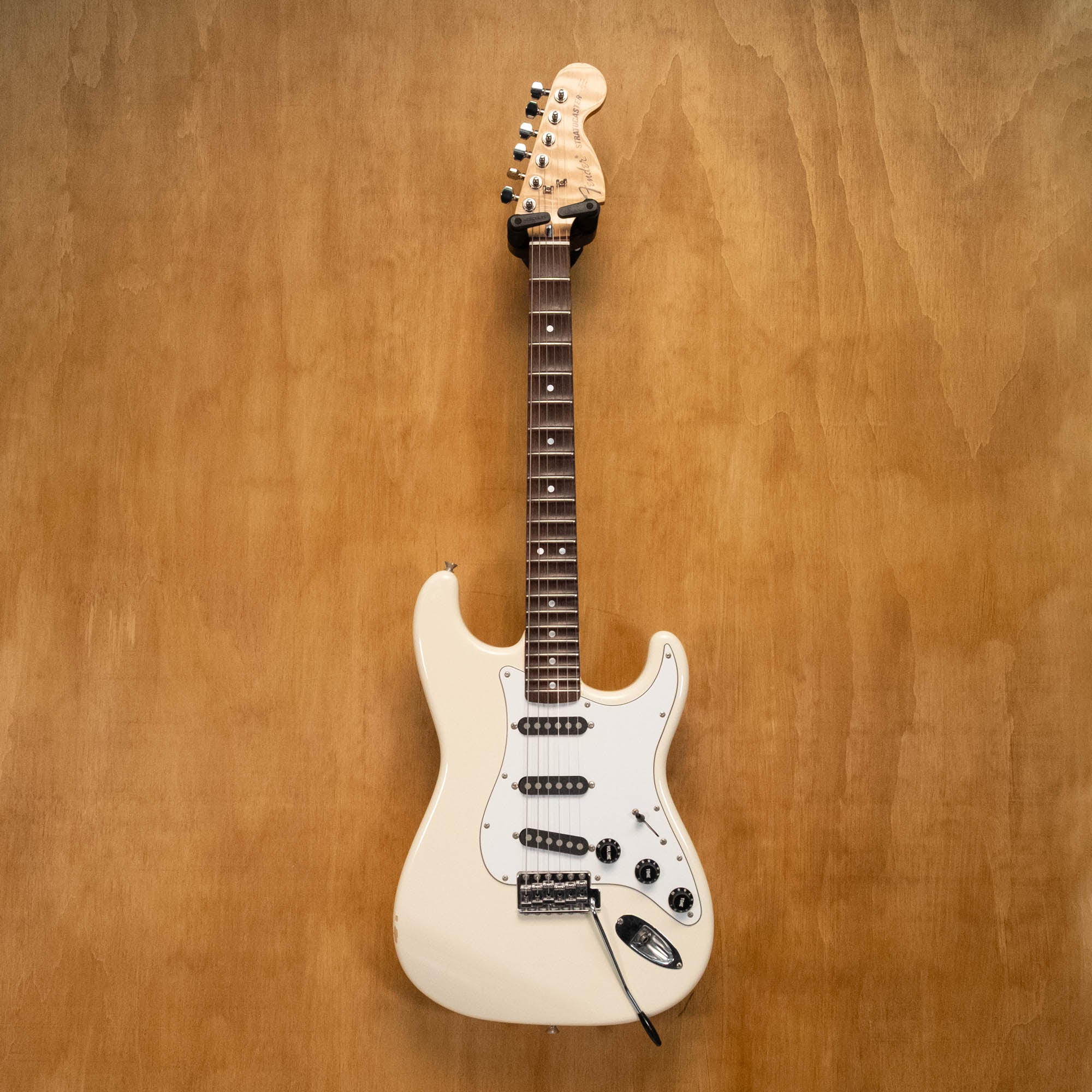 Fender '72 Stratocaster electric guitar with scalloped fingerboard in Olympic White, made in Japan, vintage style, preowned.