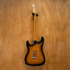 Fender '57 Stratocaster electric guitar in 2-tone sunburst finish, made in Japan, vintage style with maple neck and chrome hardware.