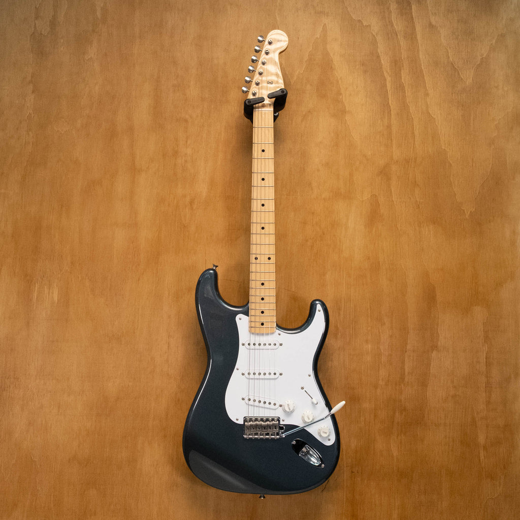 Fender '57 Stratocaster electric guitar in gunmetal blue with Texas Specials pickups, made in Japan, with a glossy finish and vintage style.