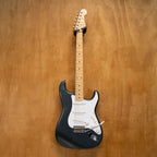 Fender '57 Stratocaster electric guitar in gunmetal blue with Texas Specials pickups, made in Japan, with a glossy finish and vintage style.