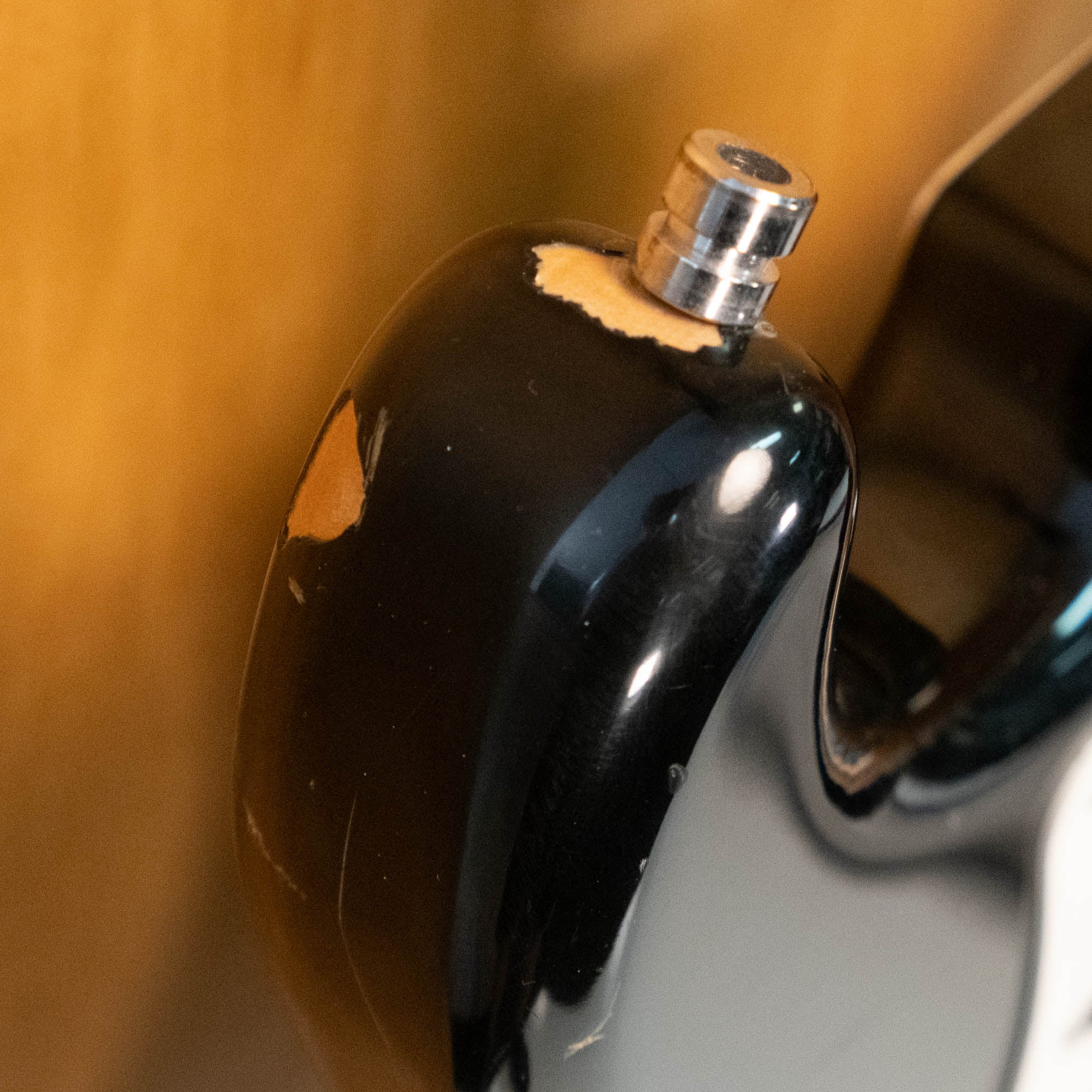 Fender '57 Stratocaster electric guitar in black, made in Japan in 1985, featuring a classic design and vintage finish.