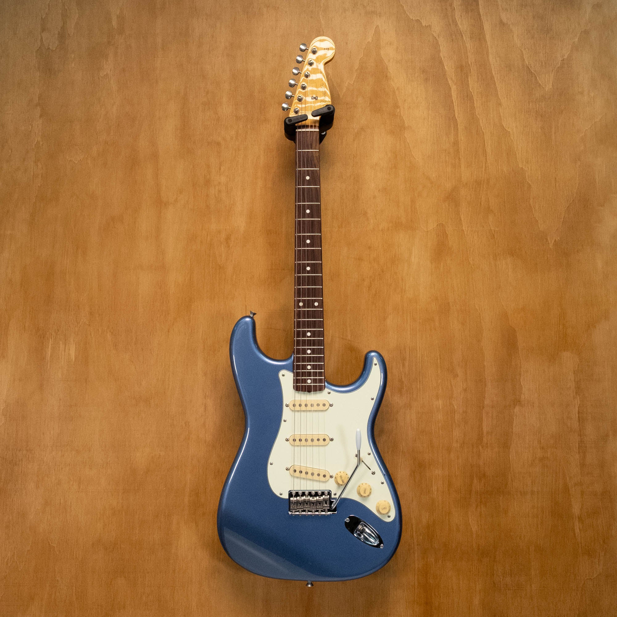 Fender '62 Stratocaster electric guitar in Old Lake Placid Blue with maple neck, body and pickups, made in Japan, preowned.