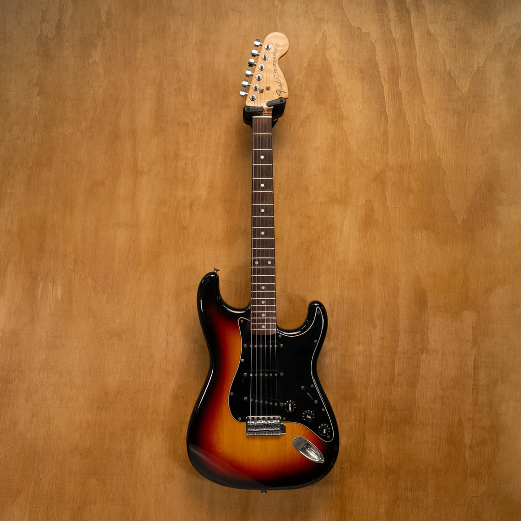 Fender '72 Stratocaster electric guitar in 3-tone sunburst finish, made in Japan, with maple neck and vintage hardware.