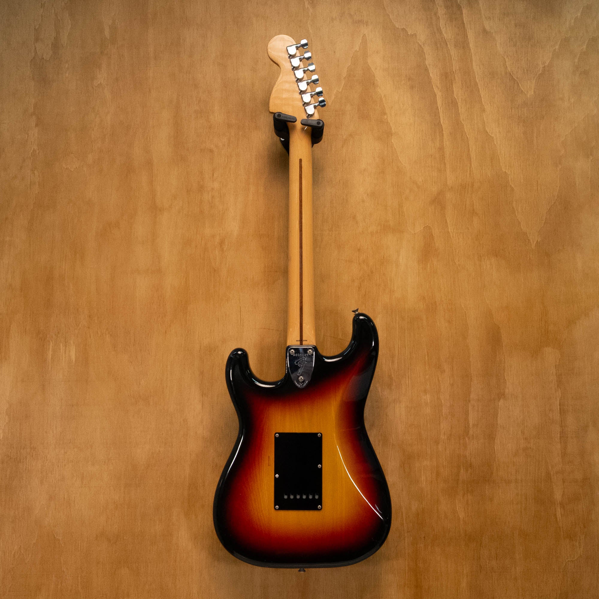 Fender '72 Stratocaster electric guitar in 3-tone sunburst finish, made in Japan, vintage style, with maple neck and three pickups.