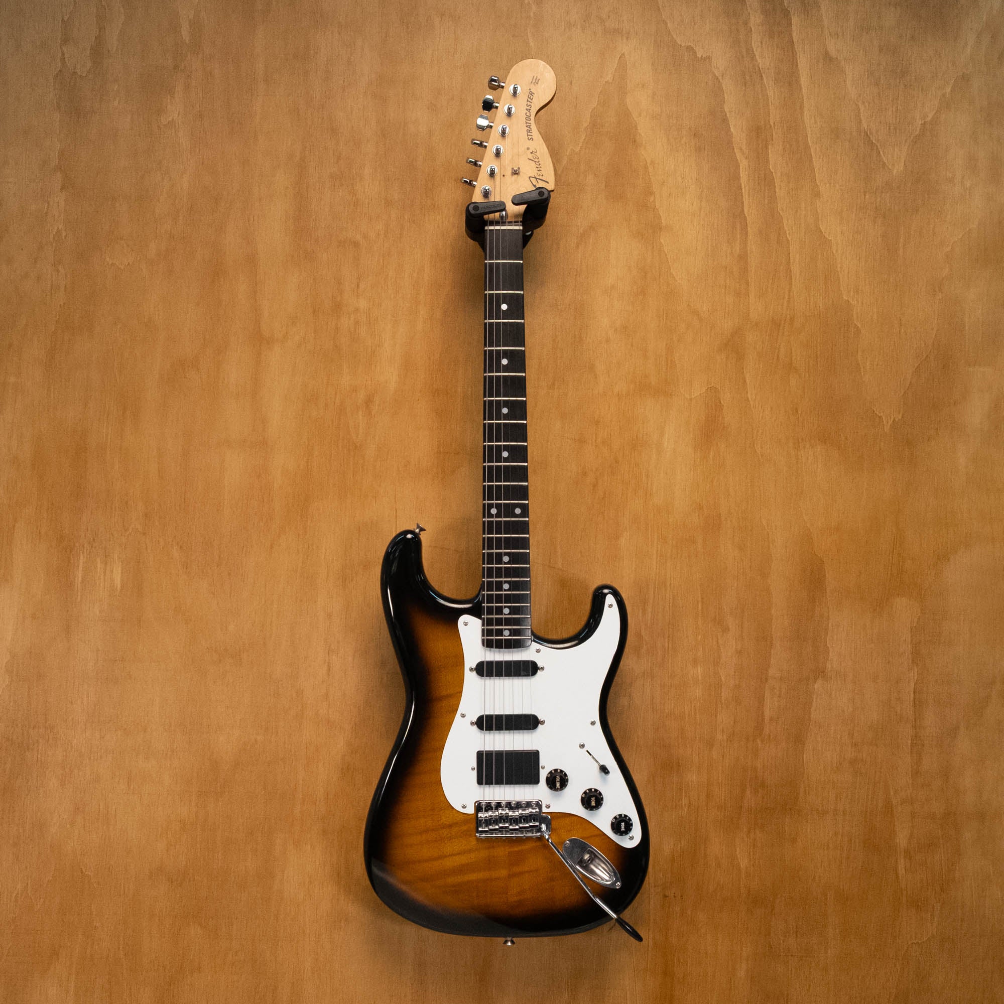 Fender '72 Stratocaster electric guitar in 2-tone Sunburst with EMG pickups, made in Japan '86, showing the guitar's body and hardware.