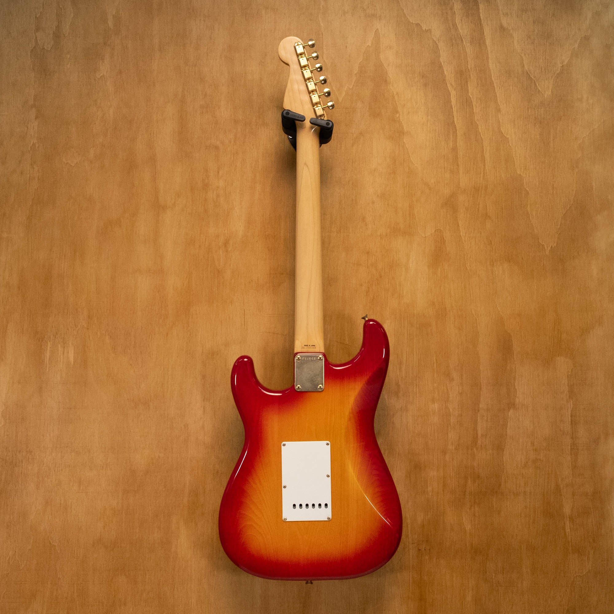 Fender '62 Stratocaster electric guitar in cherry burst finish, made in Japan 1991, shown with classic body and maple neck.