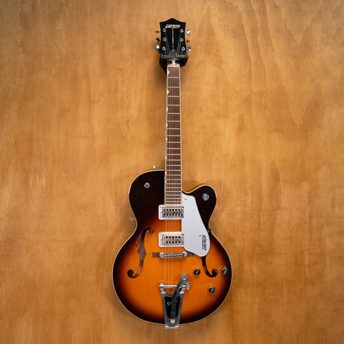 Gretsch Electromatic G5120 electric guitar with TV Jones pickups, black finish, and chrome hardware, shown from front angle.