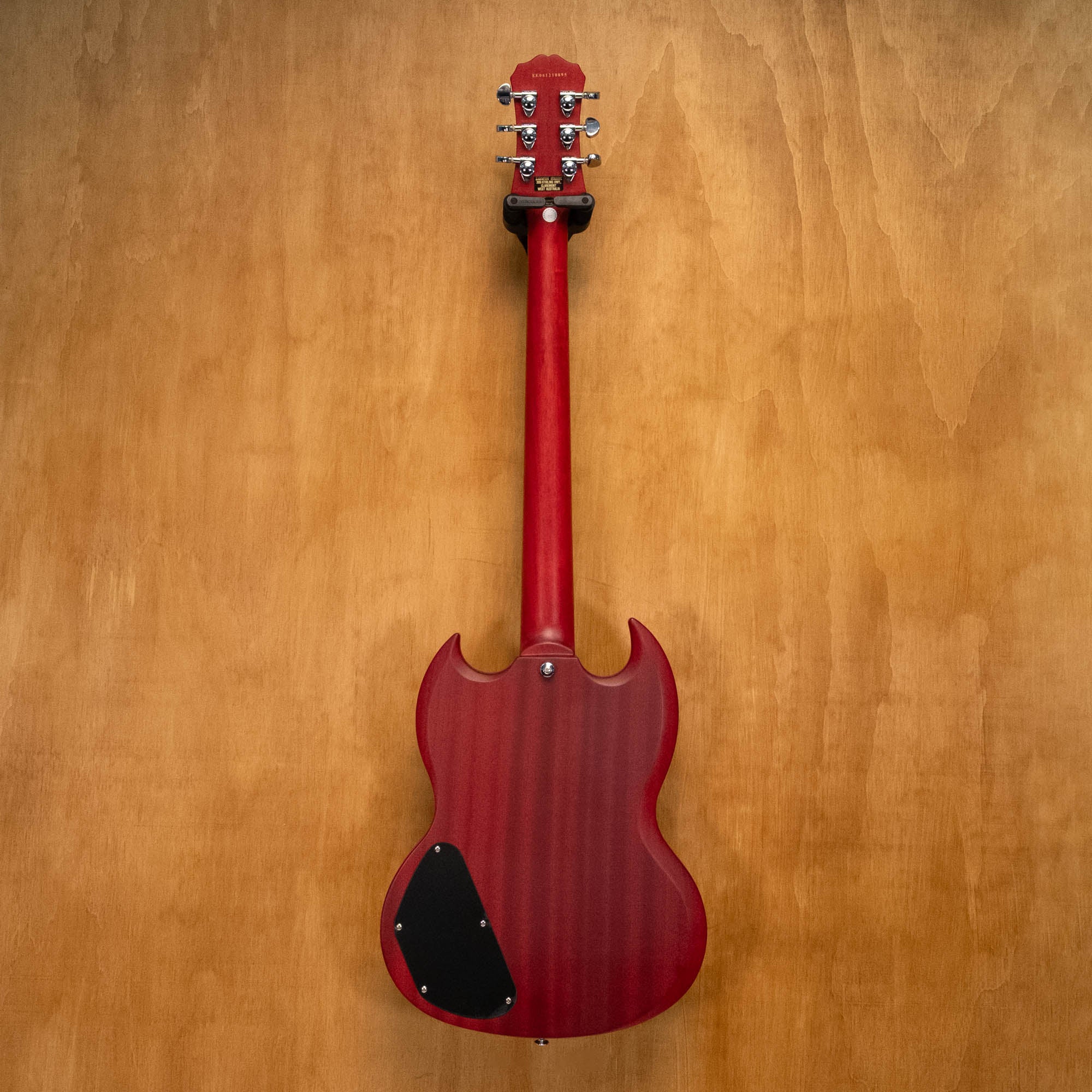 Epiphone SG Standard electric guitar in Worn Cherry finish, showing the body and neck with hardware details.