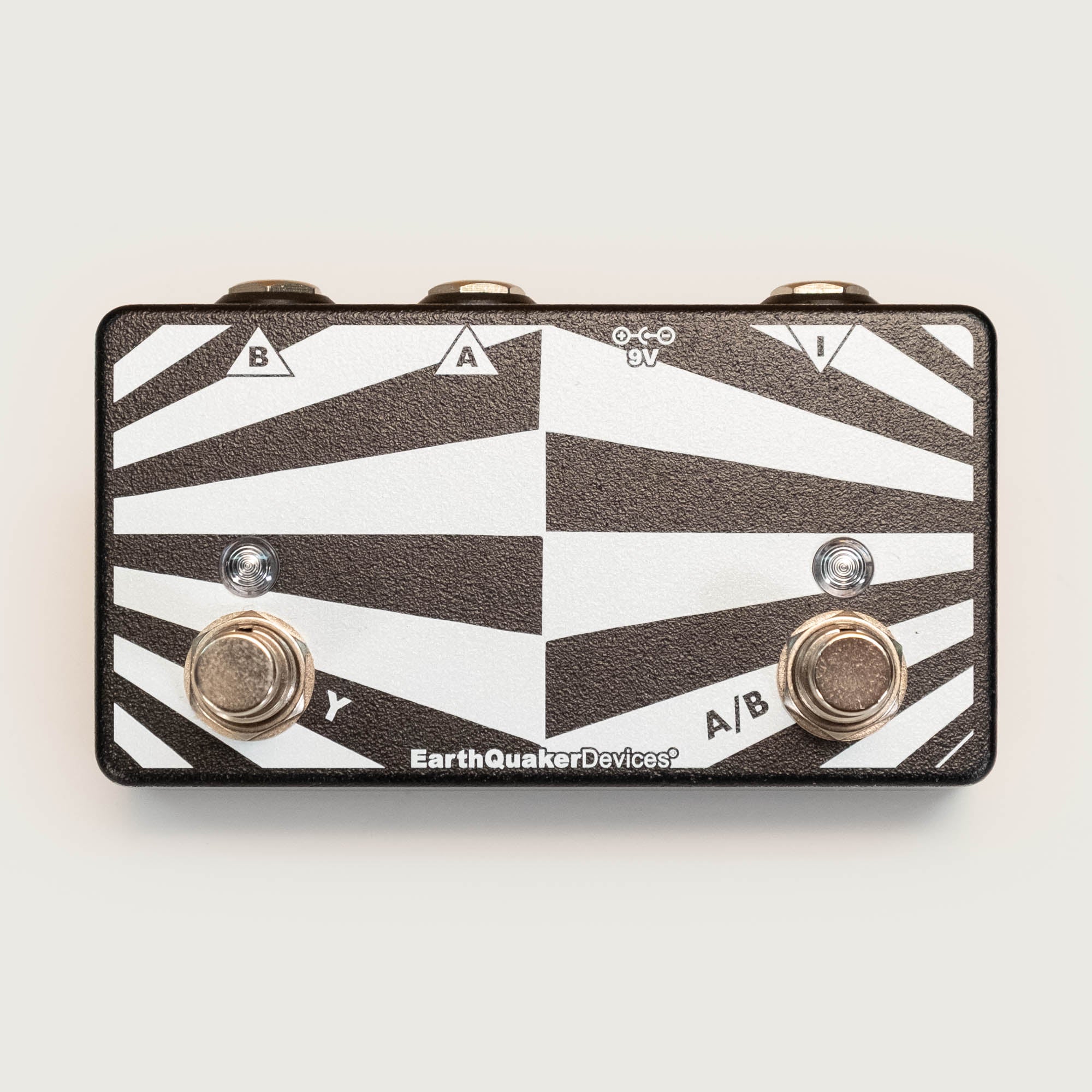 Earthquaker Devices Passive ABY Box guitar effects pedal showing input and output jacks on a black metal enclosure.