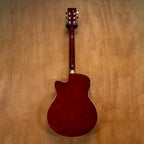 Huxley Sunburst acoustic guitar with a natural wood finish, showcasing its body, strings, and tuning pegs.