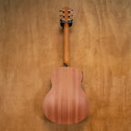 Taylor GS Mini-E Mahogany acoustic guitar, preowned, with a compact body and natural wood finish, displayed on a stand.
