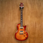 PRS SE 245 single cutaway electric guitar in vintage sunburst finish, featuring a sleek body and dual humbucker pickups.