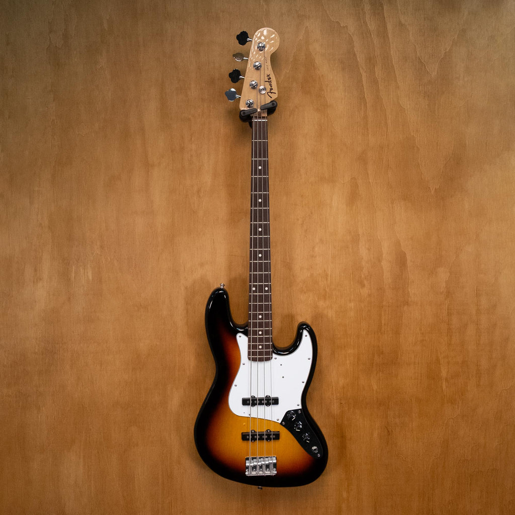 Fender Standard Jazz Bass Guitar in sunburst finish with four strings and classic design, shown in a close-up view.