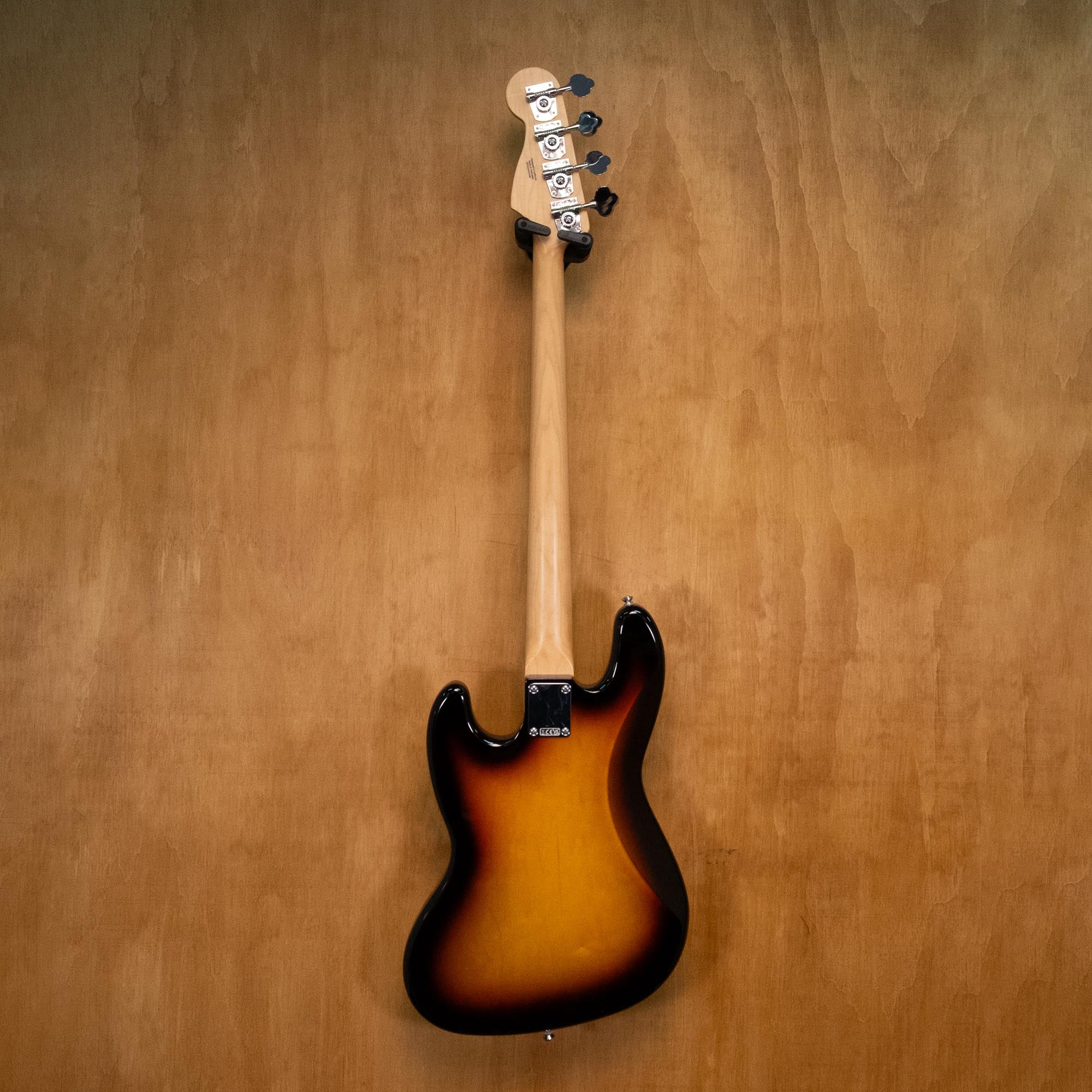 Fender Standard Jazz Bass Guitar in sunburst finish, featuring a sleek body, four strings, and classic design, photographed from the front.