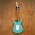 Fender Vintera '50s Stratocaster electric guitar in Sea Foam Green, with vintage-style body and maple neck, preowned and mint condition.