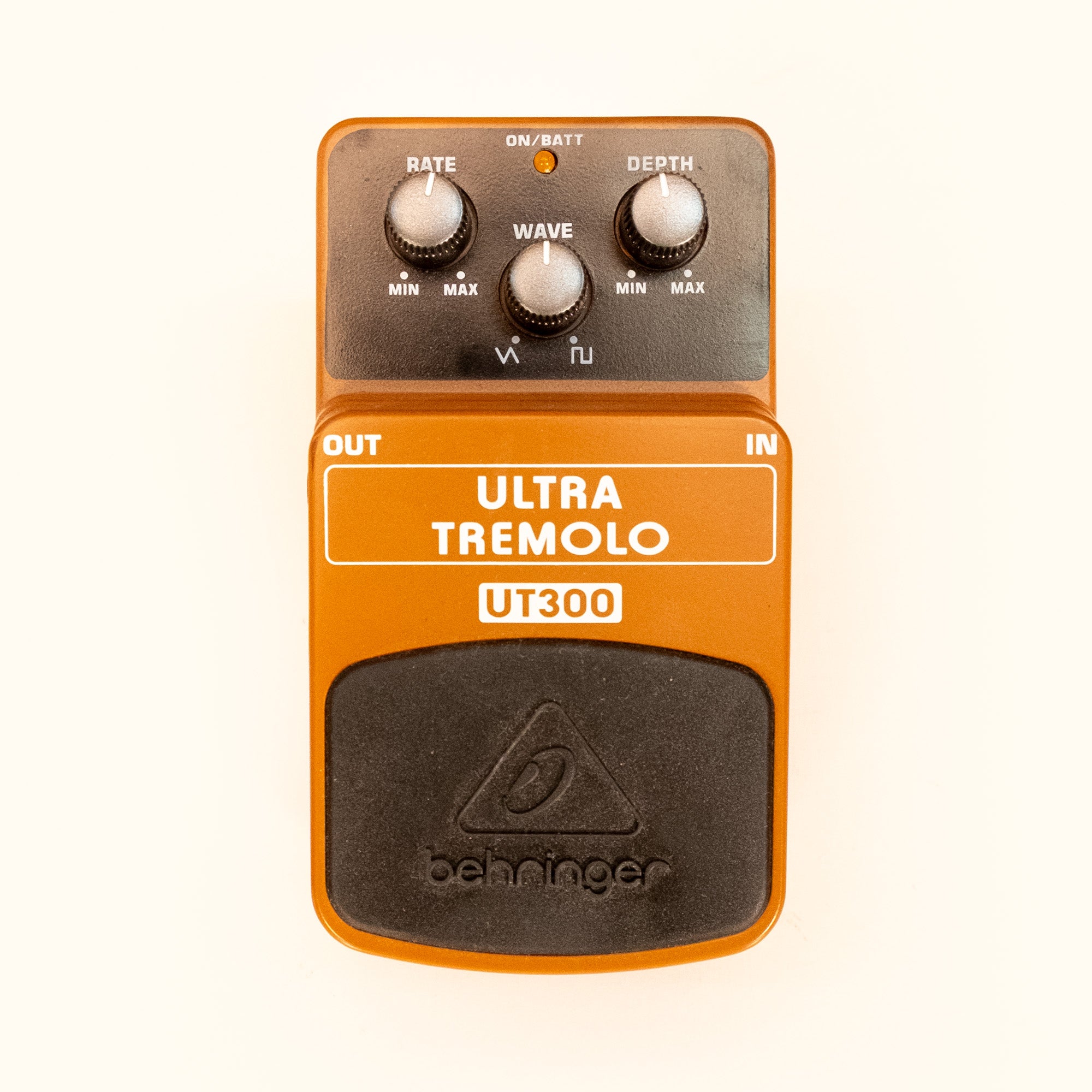 Behringer UT300 Ultra Tremolo guitar effects pedal, showing the compact pedal with control knobs and input/output jacks.