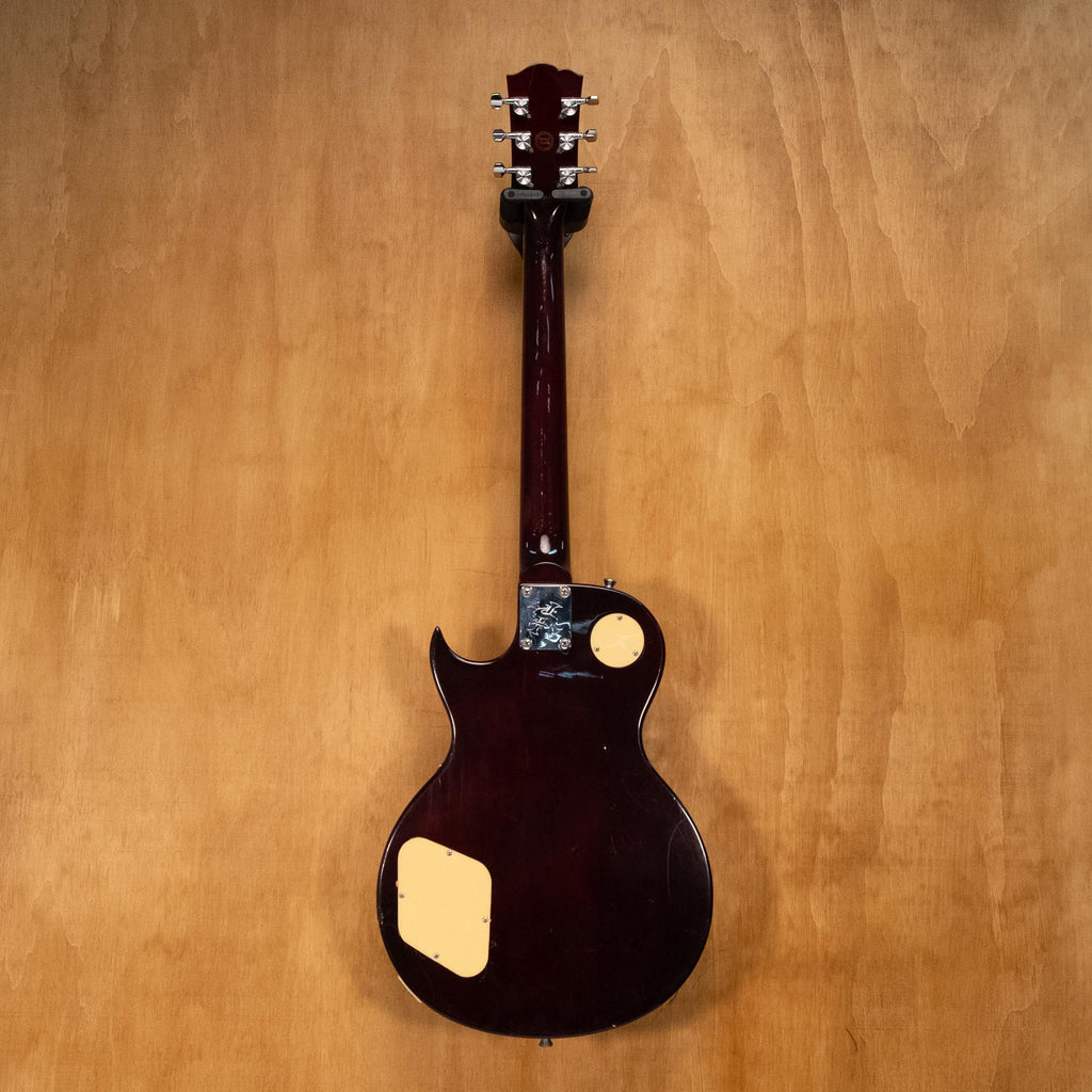 SX LP style electric guitar with upgraded hardware and electronics, showcasing a sleek black finish and classic guitar design.